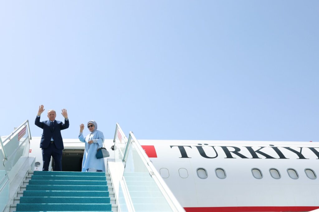 President Recep Tayyip Erdoğan (L) and first lady Emine Erdoğan wave as they embark on the presidential plane, Ankara, Türkiye, June 12, 2024. (DHA Photo)