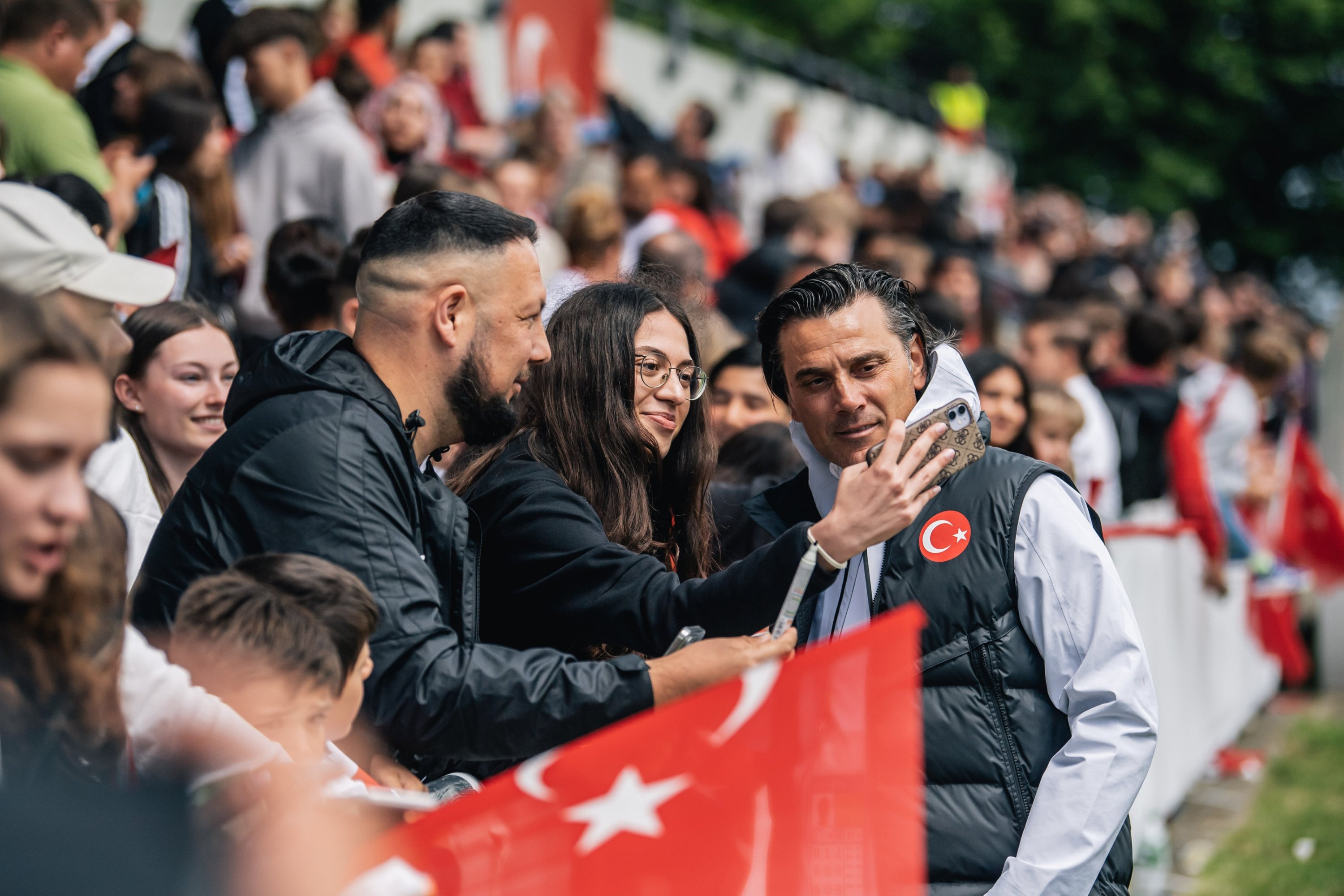 332603 Turkish national football team coach Vincenzo Montella takes selfies with fans at the August-Wenzel Stadium, Hannover, Germany, June 12, 2024. (AA Photo)