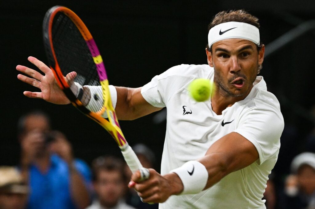 Spain's Rafael Nadal returns the ball to Italy's Lorenzo Sonego during their men's singles tennis match on the sixth day of the 2022 Wimbledon Championships at The All England Tennis Club in Wimbledon, London, U.K., July 2, 2022.  (AFP Photo)