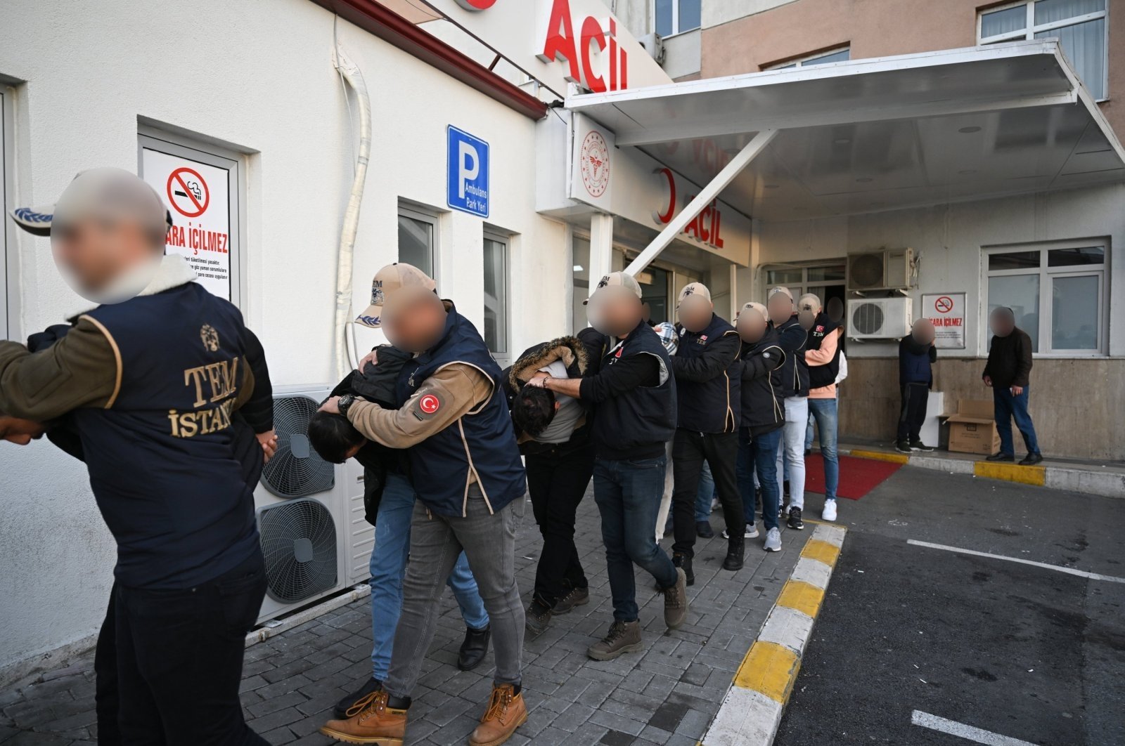 Suspects detained as part of an investigation into Mossad's activities in Türkiye are escorted by police to undergo routine medical checks, Istanbul, Türkiye, Jan. 4, 2024. (AA Photo)