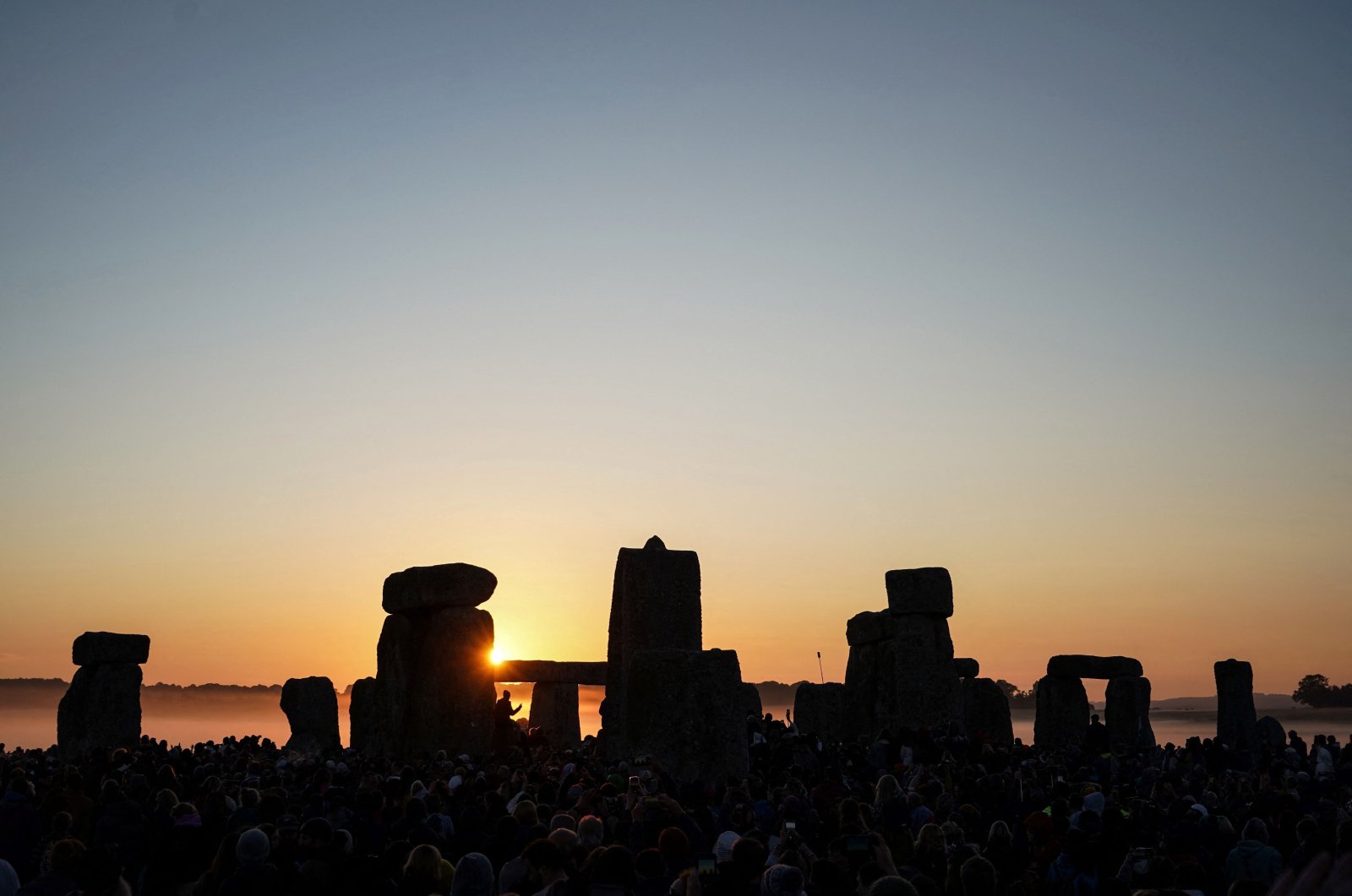 The sun rises at Stonehenge, near Amesbury, in Wiltshire, southern England, June 21, 2024. (AFP Photo)