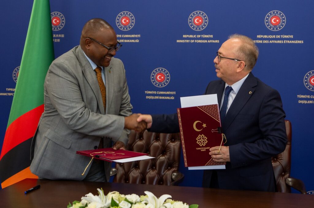 Turkish Maarif Foundation President Birol Akgün (R) and Zambian Foreign Minister Mulambo Haimbe sign a memorandum at the Foreign Ministry, Lusaka, Zambia, July 4, 2024. (AA Photo)