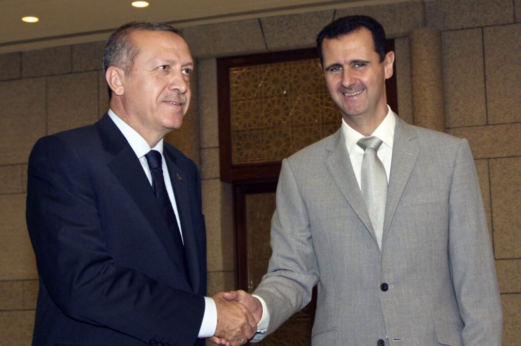 Syrian leader Bashar Assad (R) shakes hands with then-Prime Minister Recep Tayyip Erdoğan (L) at al-Shaab presidential palace, Damascus, Syria, Oct. 11, 2010. (AP Photo)