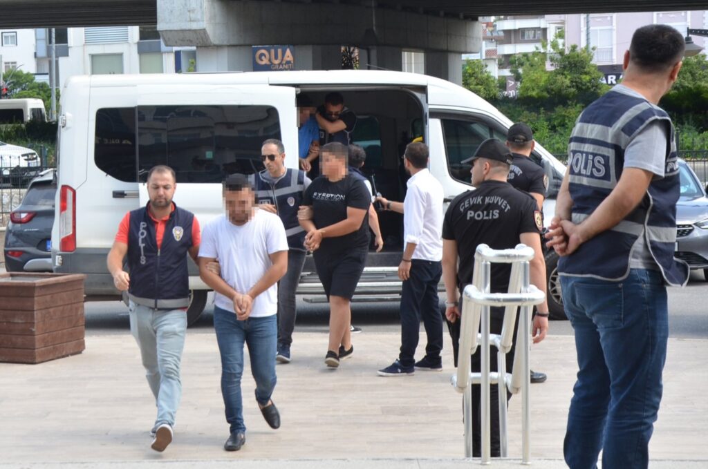 Police escort to the courthouse 11 suspects involved in attacks on Syrian-owned shops and vehicles in southern Antalya province, Türkiye, July 4, 2024. (DHA Photo)