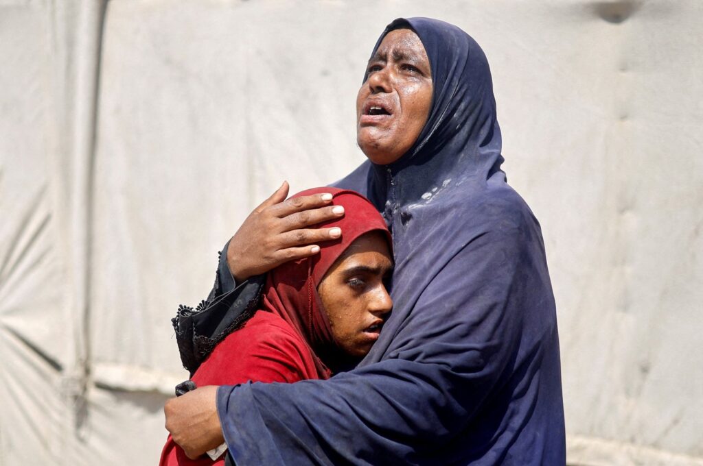 Palestinian people, who fled the eastern part of Khan Younis after they were ordered by the Israeli army to leave their neighborhood, react upon their arrival at Nasser hospital, Khan Younis, Gaza Strip, Palestine, July 2, 2024. (Reuters Photo)