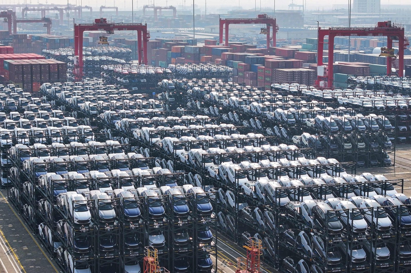 BYD electric cars waiting to be loaded onto a ship are seen stacked at the international container terminal of Taicang Port in Suzhou, in eastern Jiangsu province, China, Feb. 8, 2024. (AFP Photo)