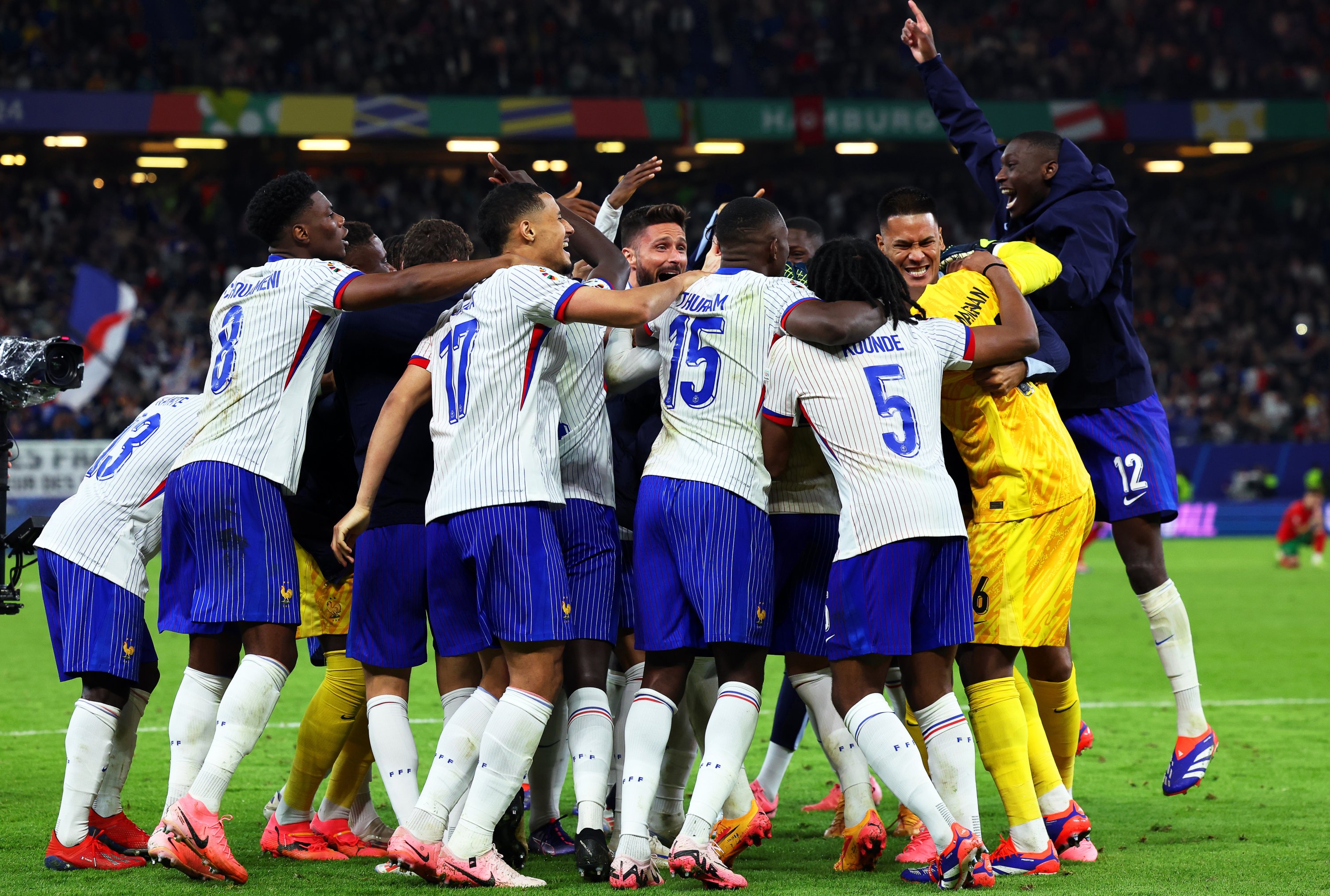 335832 France's players cheer after the Euro 2024 quarterfinal penalty shoot-out against Portugal, Hamburg, Germany, July 6, 2024. (Getty Images Photo)