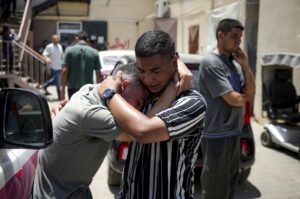 Palestinians mourn relatives killed in the Israeli bombardment of the Gaza Strip, at a hospital morgue, Deir al-Balah, Palestine, July 9, 2024. (AP Photo)