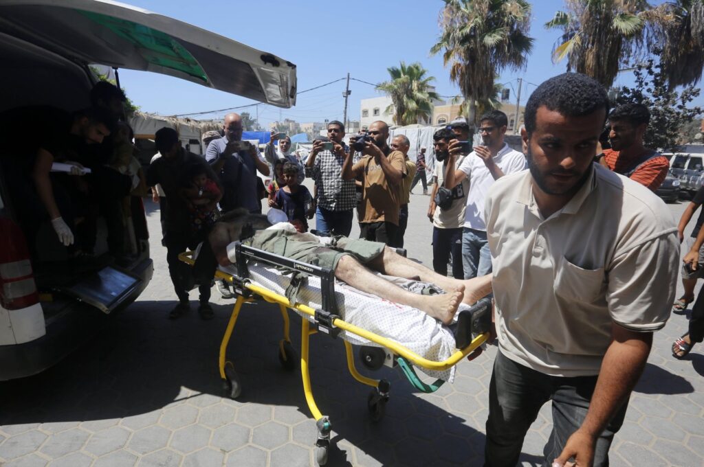 People carry the injured to a hospital after an Israeli attack on a refugee camp, Deir al-Balah, Gaza Strip, Palestine, July 9, 2024. (AA Photo)