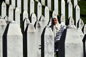 Bosnian Muslim survivor of the 1995 Srebrenica genocide stands among headstones at the memorial cemetery in village of Potocari, Srebrenica, Bosnia, July 11, 2024. (AFP Photo)