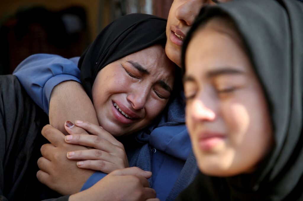 Relatives of a Palestinian killed in an Israeli strike react at the site of the strike, near a school sheltering displaced people, amid the Israel-Palestine conflict, Khan Younis, Gaza Strip, July 10, 2024. (Reuters Photo)