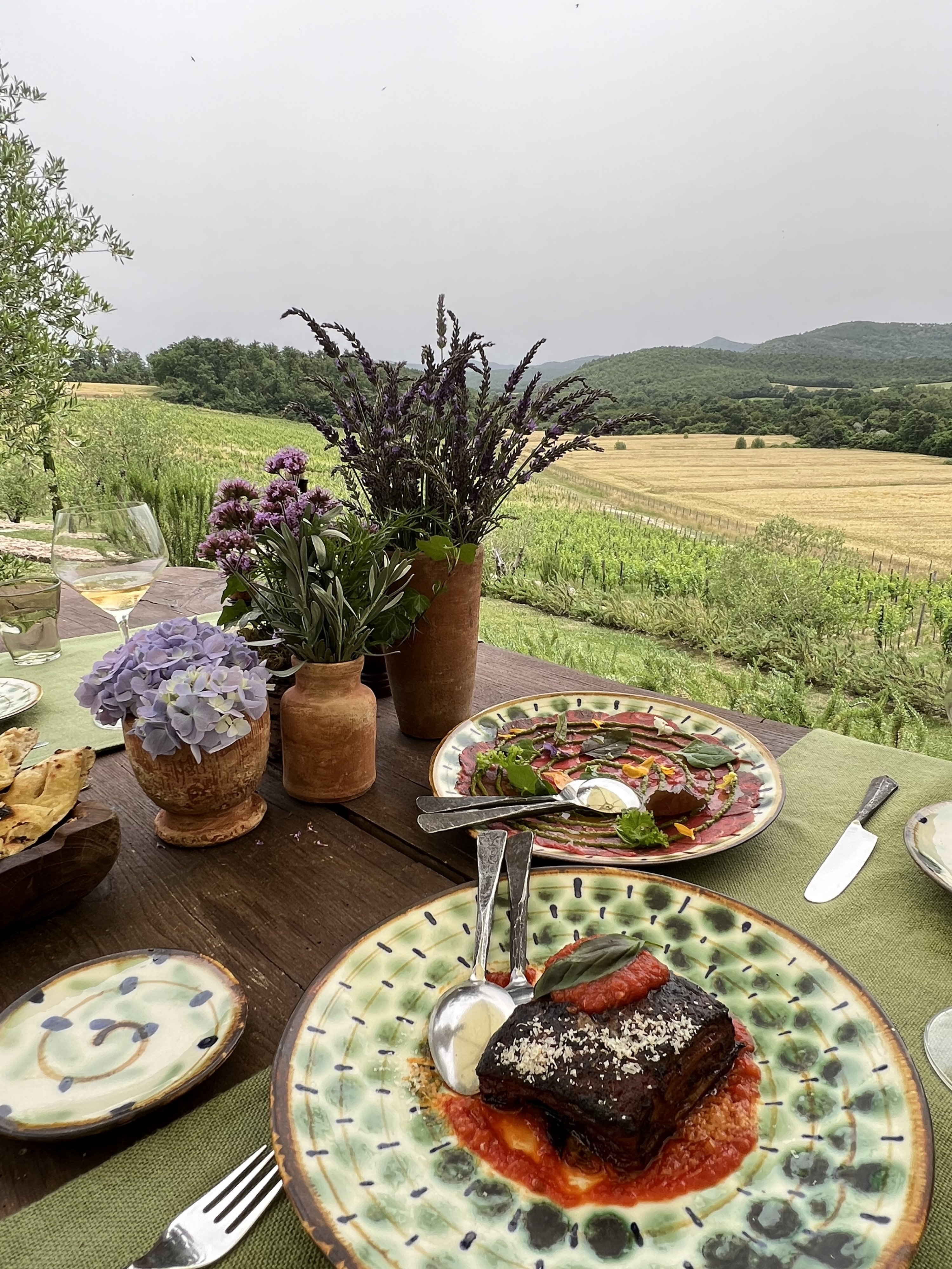 336802 At Trattoria sull'Albero, guests savor gourmet dishes amid a serene atmosphere, enhanced by fresh, locally sourced produce, Tuscany, Italy, July 19, 2024. (Photo by İlker Topdemir)