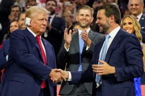 Republican presidential nominee and former U.S. President Donald Trump (L) and Republican vice presidential nominee J.D. Vance shake hands as Eric Trump watches during Day 1 of the Republican National Convention (RNC), Milwaukee, Wisconsin, U.S., July 15, 2024. (Reuters Photo)