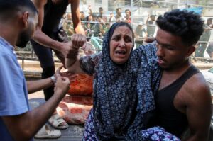A Palestinian woman wounded in an Israeli strike is rushed into Al-Nasser Hospital following an Israeli strike, Gaza Strip, Palestine, July 16, 2024. (Reuters Photo)