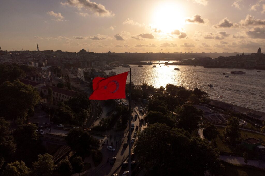 A drone view shows a Turkish flag flying over Sarayburnu with the Golden Horn in the background in Istanbul, Türkiye, June 21, 2024. (Reuters Photo)