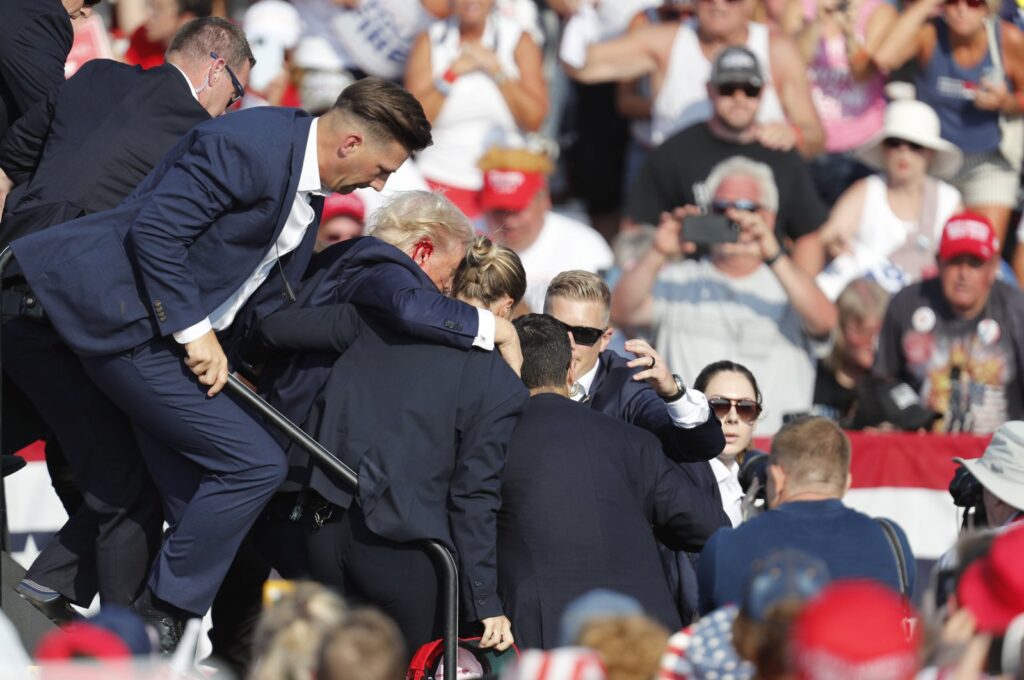 Former U.S. President Donald Trump is rushed from the stage by the Secret Service after being shot at during a campaign rally at the Butler Farm Show Inc. in Butler, Pennsylvania, U.S., July 13, 2024. (EPA Photo)