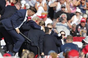Former U.S. President Donald Trump is rushed from the stage by the Secret Service after being shot at during a campaign rally at the Butler Farm Show Inc. in Butler, Pennsylvania, U.S., July 13, 2024. (EPA Photo)