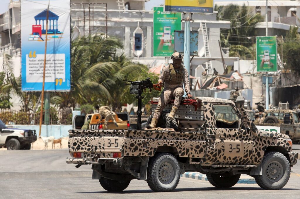 A Somali security officer stands guard near Syl Hotel, the scene of an al-Shabab terrorist attack, Mogadishu, Somalia, March 15, 2024. (Reuters Photo)