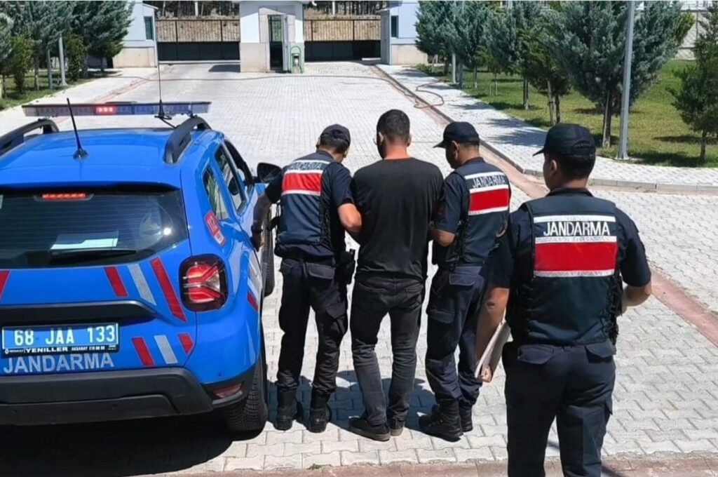 Gendarmerie officers escort a convicted FETÖ fugitive in central Aksaray province, Türkiye, July 16, 2024. (AA Photo)