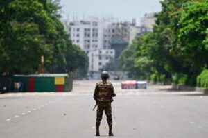 A Bangladesh army personnel stands guard near the Parliament house amid a curfew in Dhaka, Bangladesh, July 22, 2024. (AFP Photo)