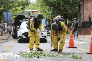 South Korean army soldiers wearing protective gear check the debris from a balloon sent by North Korea, July 24, 2024, in Seoul, South Korea. (AP Photo)