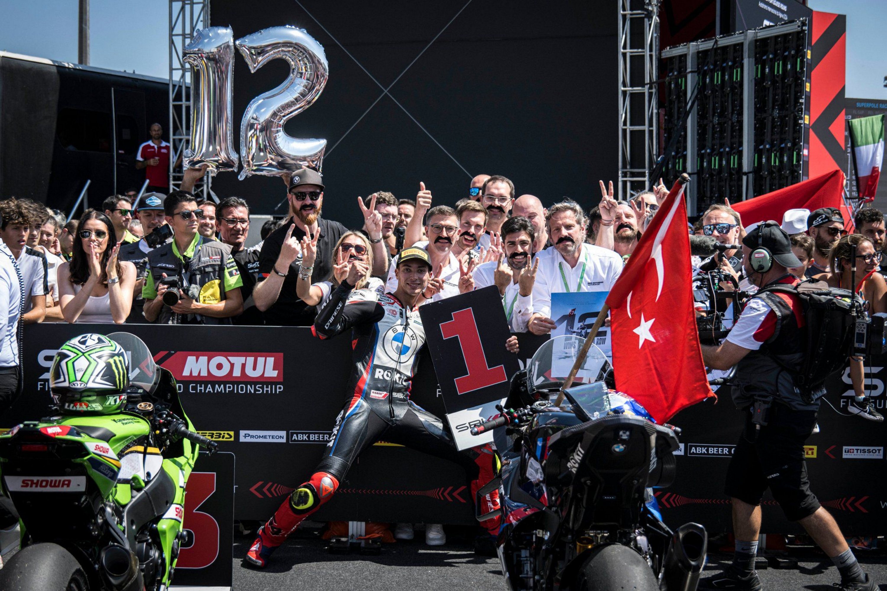 342073 Turkish motorcyclist Toprak Razgatlıoğlu (C) celebrates after breaking the championship record with 12 consecutive victories by winning the Superpole race of the seventh leg of the World Superbike Championship, Lisbon, Portugal, Aug. 11, 2024. (AA Photo)