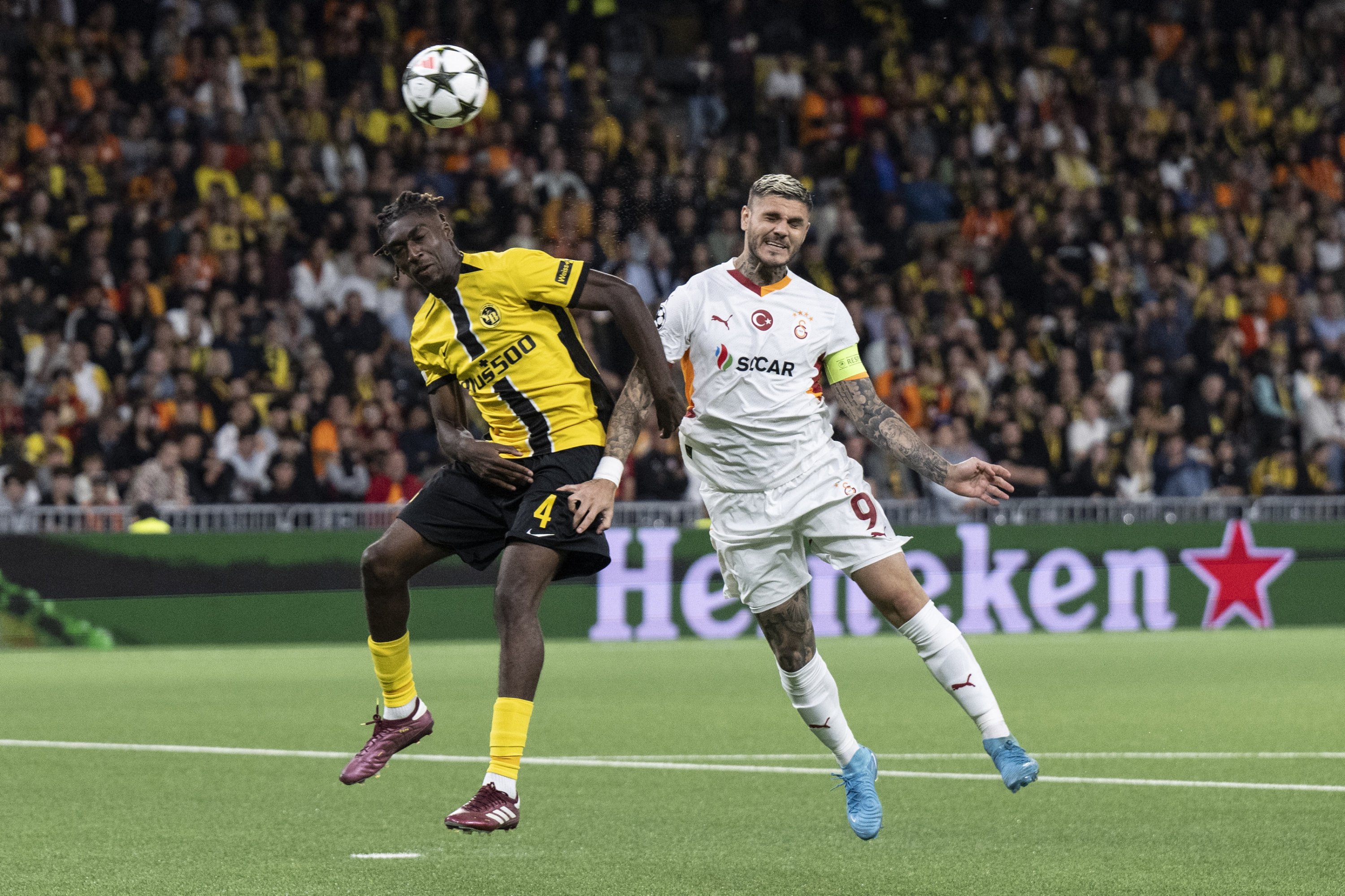 343059 Young Boys' Tanguy Zoukrou (L) in action against Galatasaray's Mauro Icardi during the UEFA Champions League play-off first leg match, Bern, Switzerland, Aug. 21, 2024. (EPA Photo)