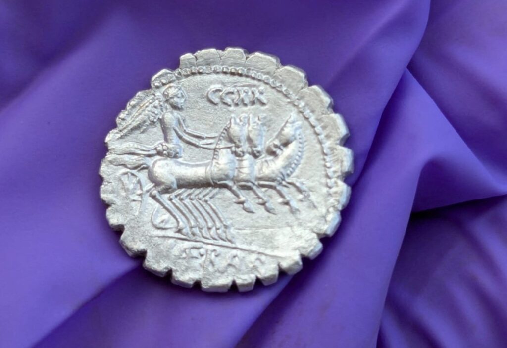 A handout picture shows one of the coins of a treasure of 27 silver Roman coins dated between 94 and 74 B.C. that was discovered on the remote island of Pantelleria, Sicily, Italy Sept. 2, 2024. (Reuters Photo)