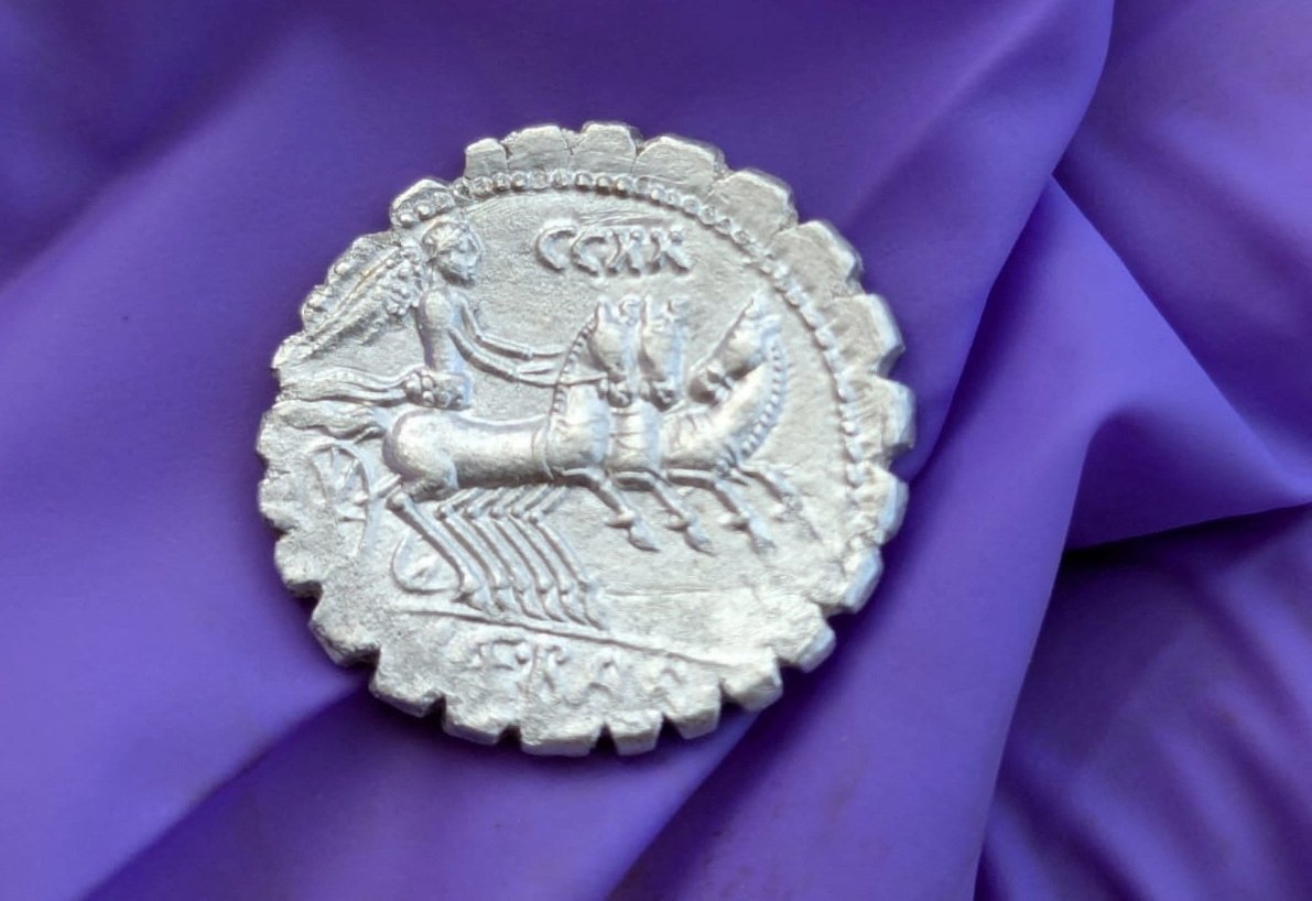 A handout picture shows one of the coins of a treasure of 27 silver Roman coins dated between 94 and 74 B.C. that was discovered on the remote island of Pantelleria, Sicily, Italy Sept. 2, 2024. (Reuters Photo)