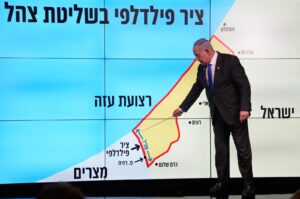 Israeli Prime Minister Benjamin Netanyahu stands in front of a map of the Gaza Strip, telling viewers that Israel must retain control over the "Philadelphi Corridor," a strategic area along the territory's border with Egypt, during a news conference in west Jerusalem, Israel, Sept. 2, 2024.(AFP Photo)