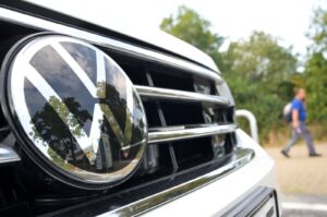 A person walks near a Volkswagen vehicle, ahead of a Volkswagen's works council regular meeting with workers in Wolfsburg, Germany, Sept. 3, 2024. (Reuters Photo)