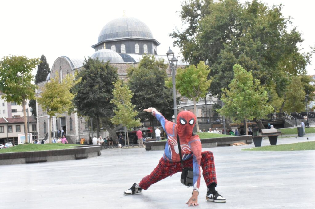 Ayaz Koç, known as "Turkish Spider-Man," poses in front of a historic mosque during his nationwide tour, Balıkesir, western Türkiye, Sept. 12, 2024. (AA Photo)