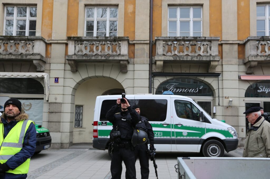 German police document some PKK flags and banners during a pro-PKK demonstration in Munich, Germany, Feb. 10, 2018. (Getty Images Photo)