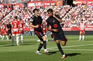 Barcelona's Lamine Yamal (R) celebrates scoring their second goal with Pau Cubarsi during the La Liga match against Girona at the Estadi Montilivi, Girona, Spain, Sept. 15, 2024. (Reuters Photo)