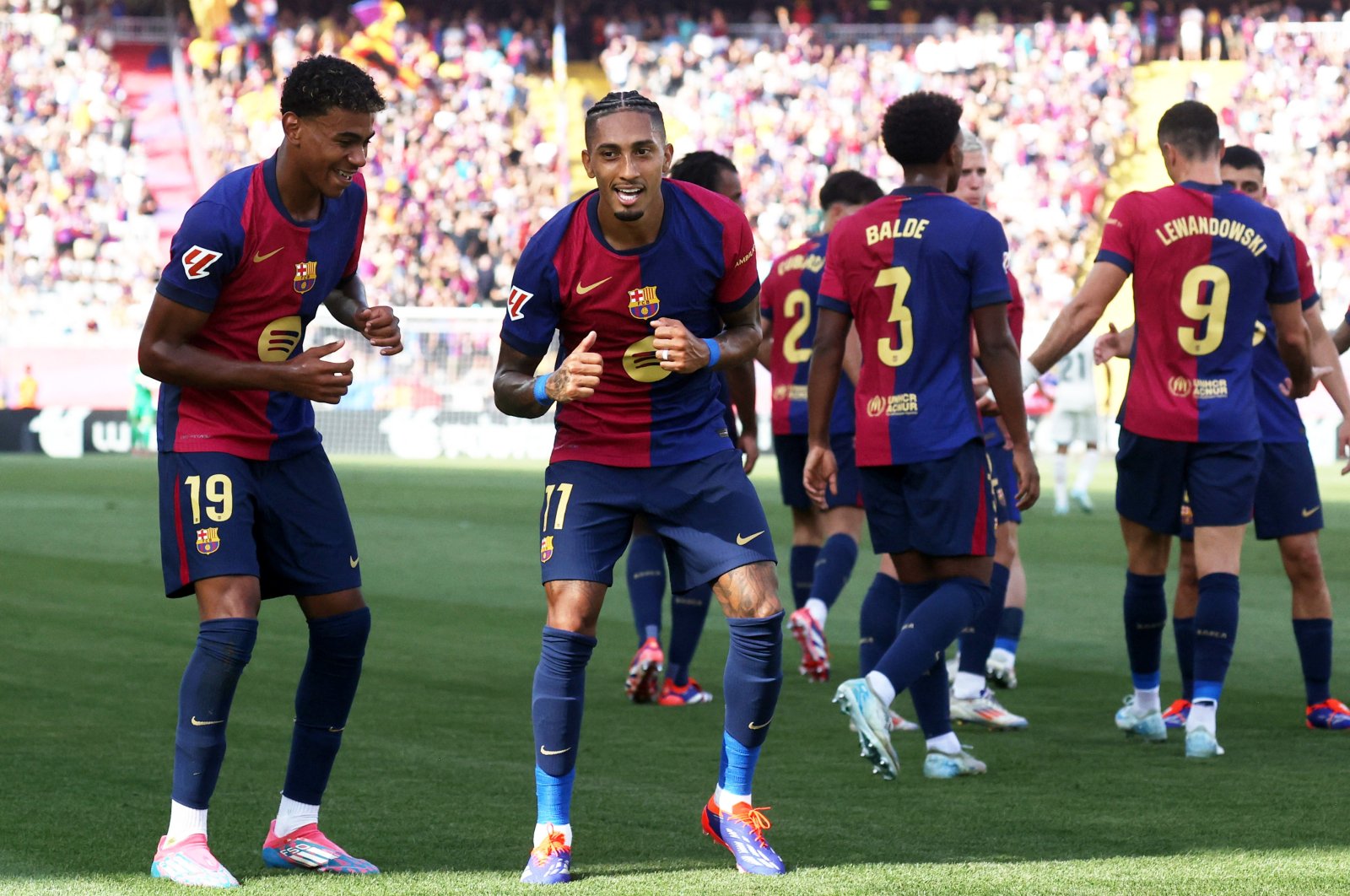 Barcelona's Raphinha (R) celebrates scoring their first goal with Lamine Yamal during the La Liga match against Real Valladolid, Estadi Olimpic Lluis Companys, Barcelona, Spain, Aug. 31, 2024. (Reuters Photo)