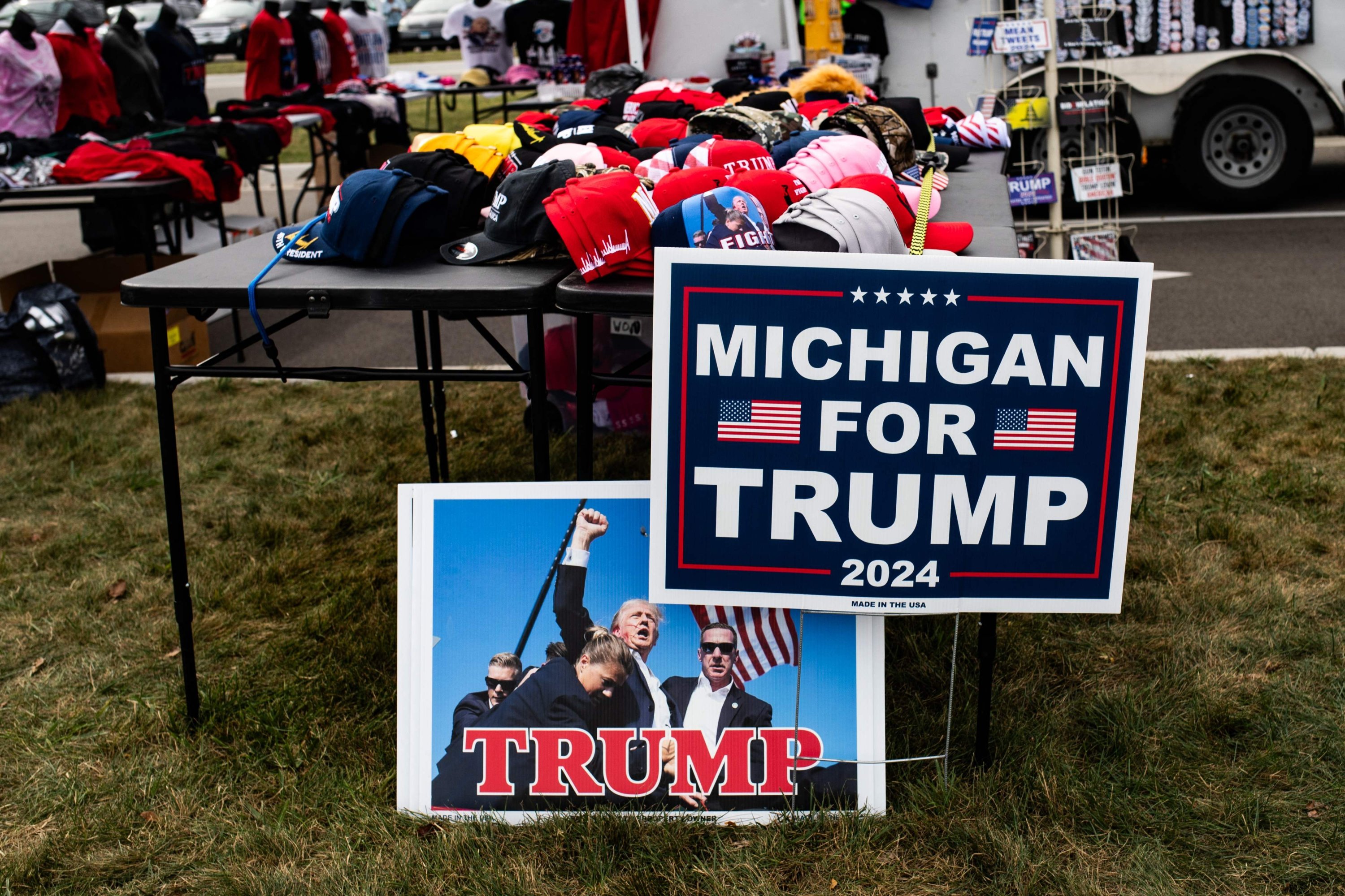 348208 Merchandise is on display outside of a town hall event with former U.S. President and Republican presidential nominee Donald Trump at Macomb Community College, Michigan, U.S., Sept. 27, 2024. (Getty Images via AFP Photo)