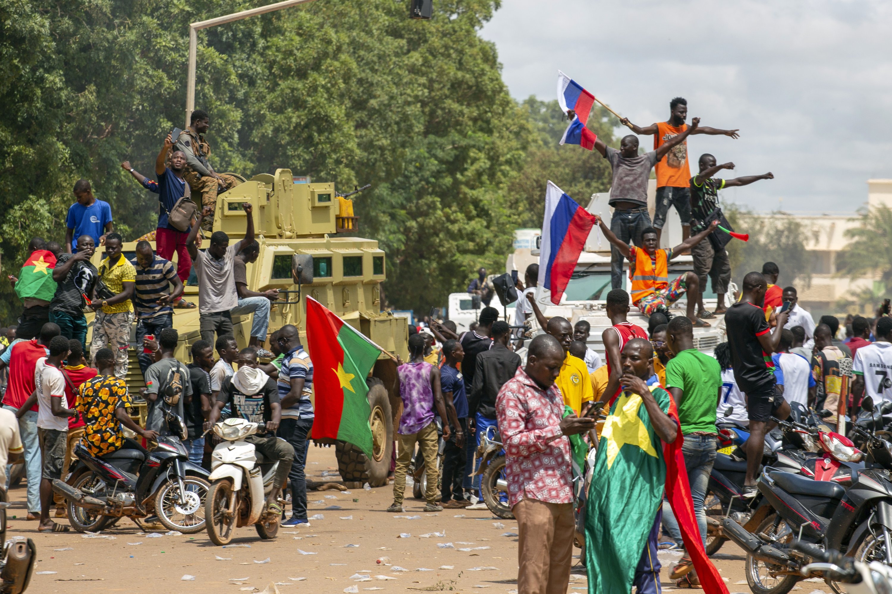 348500 Supporters of Capt. Ibrahim Traore cheer with Russian flags in the streets of Ouagadougou, Burkina Faso, Oct. 2, 2022. (AP Photo)