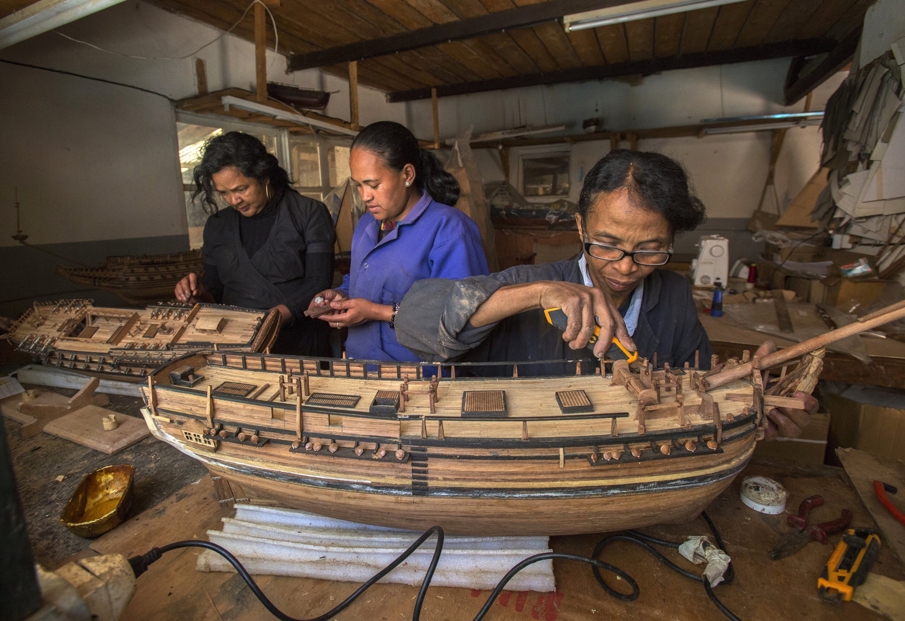 348502 Malagasy women build a model ship at the Le Village model ship-making company, Antananarivo, Madagascar, Sept. 11, 2024. (AP Photo)