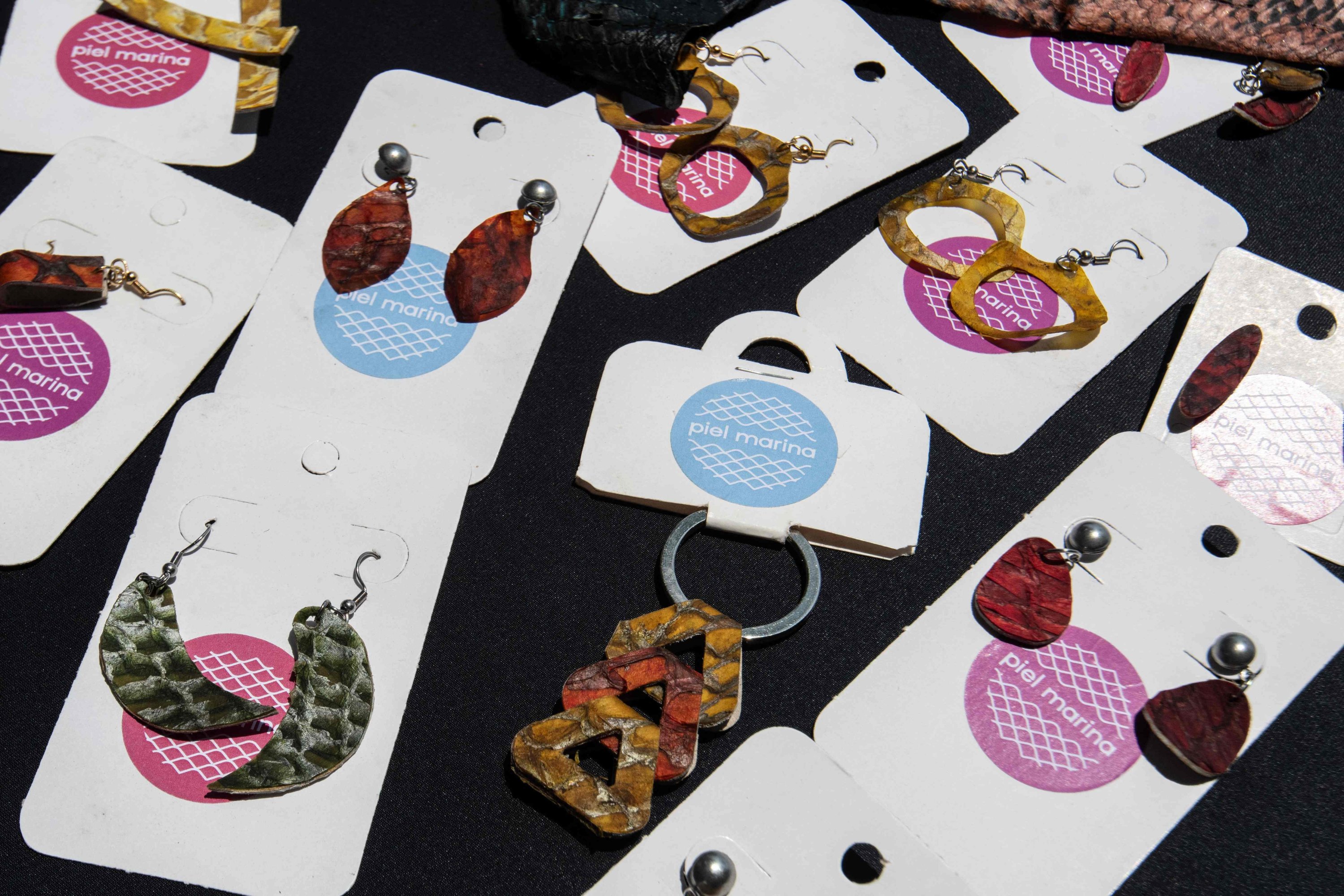 348696 View of earrings and keychains made with fish skin by women from the 'Piel Marina' (Marine Skin) cooperative at the Costa de Pájaros beach, Puntarenas, Costa Rica, Sept. 19, 2024. (AFP Photo)