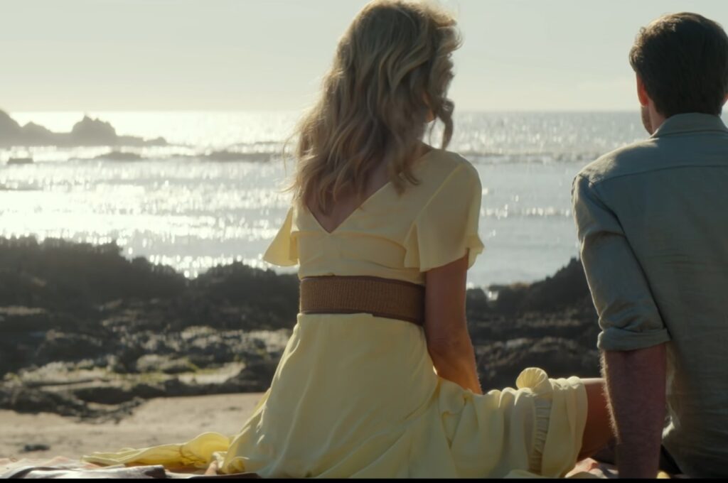 A still shot of Liam Hemsworth and Laura Dern from the movie "Lonely Planet."
