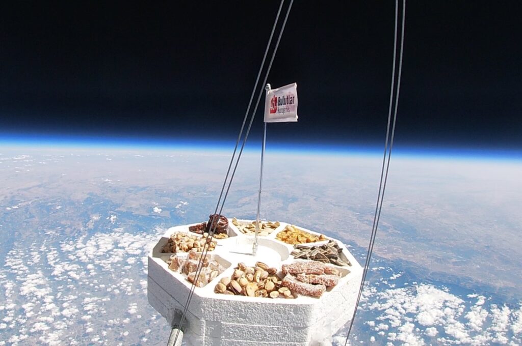 A capsule carrying nuts from Türkiye's Adana brand Bulutlar Kuruyemiş reaches space, Oct. 23, 2024. (DHA Photo)