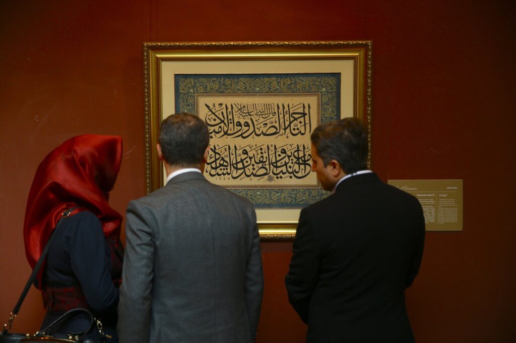 Visitors examine the artworks at the "Heritage Beyond Time: The Silk Road" exhibition in Baku, Azerbaijan, Oct. 22, 2024. (AA Photo)