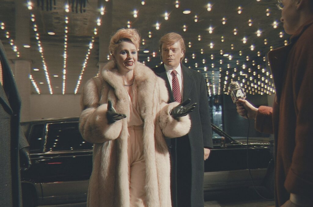This image released by Briarcliff Entertainment shows Maria Bakalova, left, and Sebastian Stan in a scene from the film "The Apprentice." (AP Photo)
