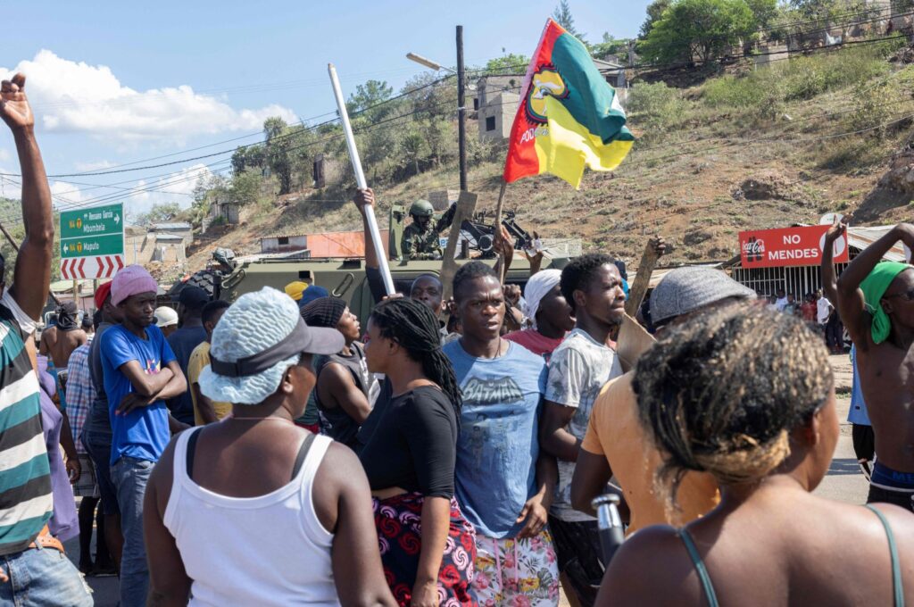 A military armoured vehicle blocks the road as protesters try to make their way to the Ressano Garcia border post between Mozambique and South Africa, Nov. 13, 2024. (AFP Photo)