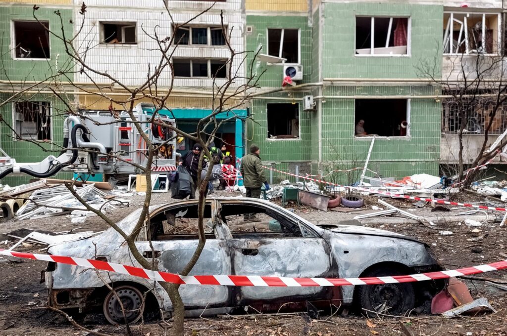 A view shows a destroyed car in front of a residential building, which was damaged by a Russian missile strike, amid Russia's attack on Ukraine, Sumy, Ukraine, Nov. 18, 2024. (Reuters Photo)