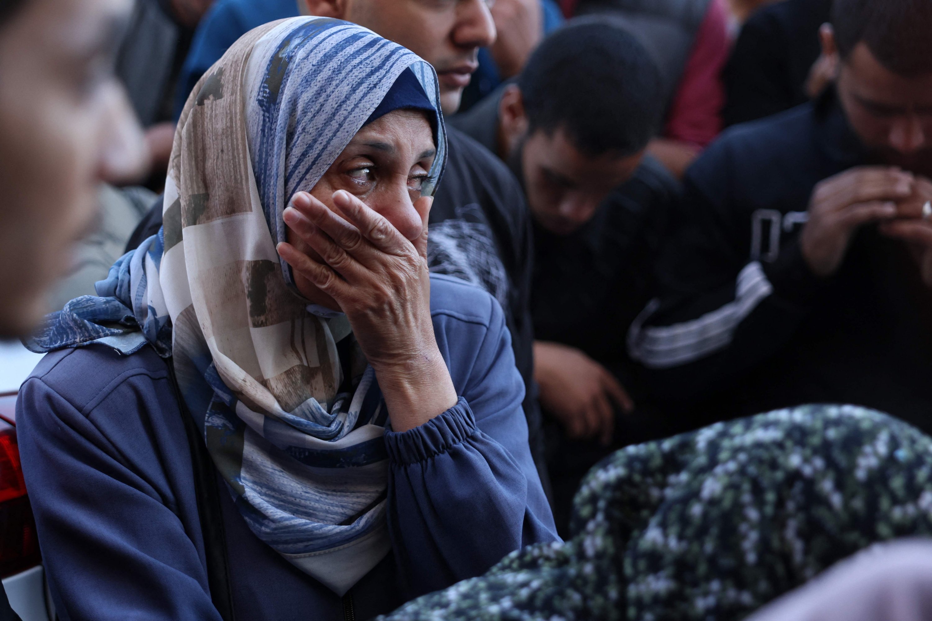355453 A Palestinian woman reacts in front of the bodies people killed in an Israeli strike, at the al-Aqsa Martyrs Hospital in Deir Al-Balah, Gaza Strip, Palestine, Nov. 17, 2024. (AFP Photo)