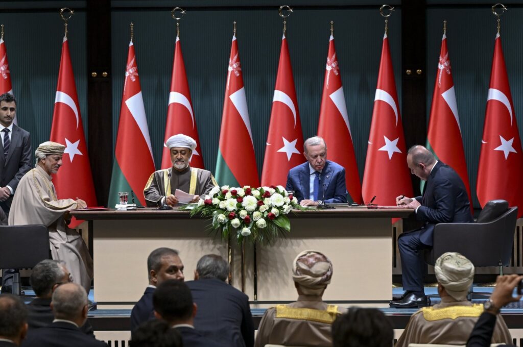 President Recep Tayyip Erdoğan (C-R) and Oman's Sultan Haitham bin Tariq Al Said (C-L) oversee a signing ceremony between OYAK and the Oman Investment Authority, Ankara, Türkiye, Nov. 28, 2024. (AA Photo)