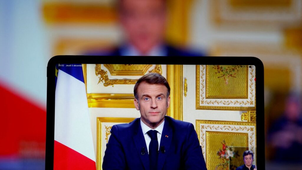 French President Emmanuel Macron appears on screen as he makes a television address to the nation after Prime Minister Michel Barnier's government was toppled in a no-confidence vote in parliament in Paris, France, Dec. 5, 2024. (Reuters Photo)