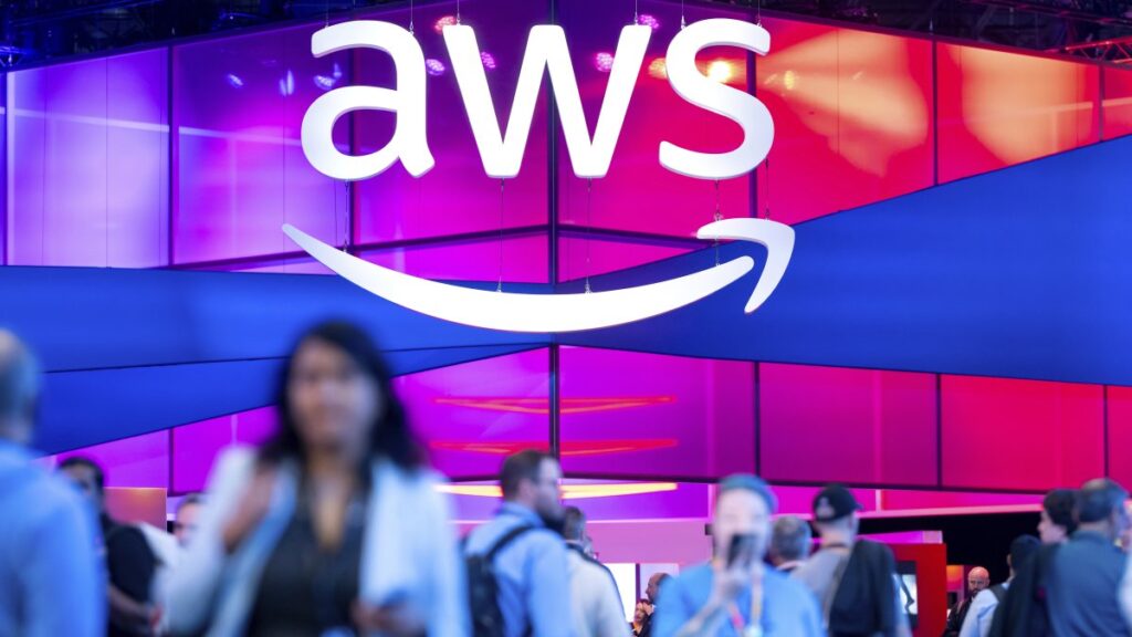 Attendees walk through an expo hall at AWS re:Invent 2024, a conference hosted by Amazon Web Services, Las Vegas, U.S., Dec. 4, 2024. (AP Photo)