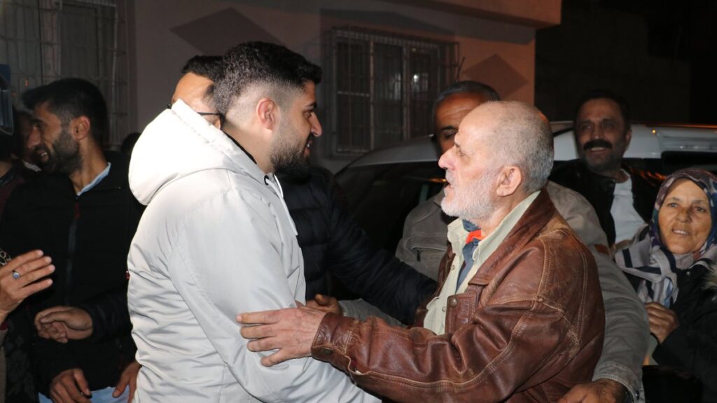 Mehmet Ertürk (R) hugs family members in Kilis, southeastern Türkiye, Dec. 9, 2024. (AA Photo)